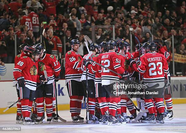 Members of the Chicago Blackhawks celebrate as Sheldon Brookbank talks to Patrick Kane who scored the game-winning goal in a shootout against the...