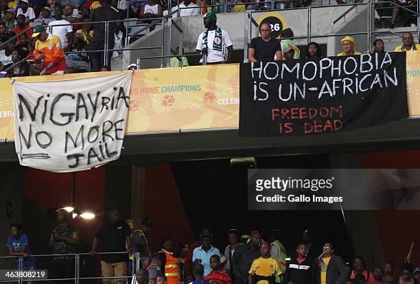 Banners in protest at the Anti-Gay Marrage Law recently passed in Nigeria are displayed in the crowd during the 2014 African Nations Championship...