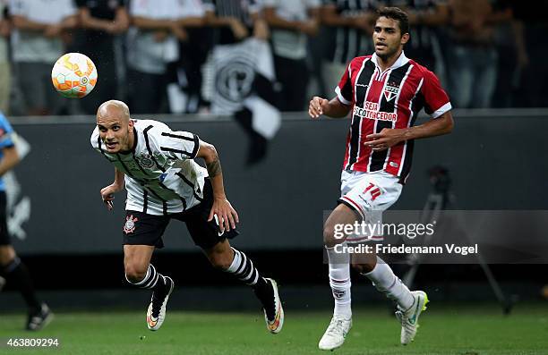 Fabio Santos of Corinthians fights for the ball with Alan Kardec of Sao Paulo during a match between Corinthians and Sao Paulo as part of Group 2 of...