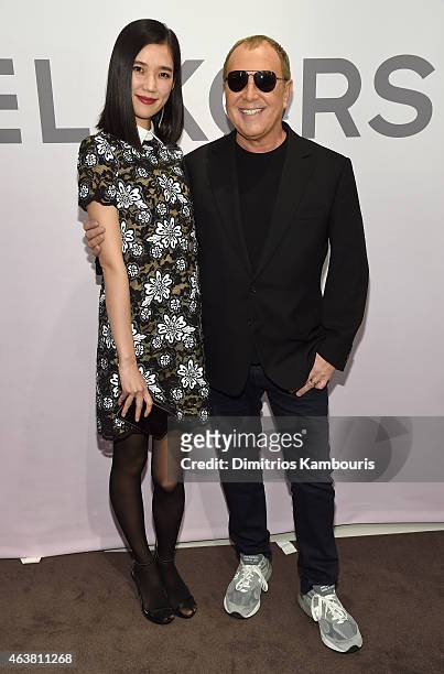 Tao Okamoto and Michael Kors attend the Michael Kors Miranda Eyewear Collection Event on February 18, 2015 in New York City.
