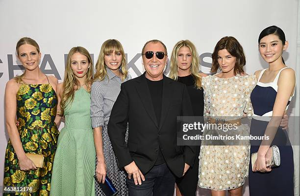 Poppy Delevingne, Harley Viera-Newton, Jessica Hart, Michael Kors, Alexandra Richards, Hanneli Mustaparta and Ming Xi attend the Michael Kors Miranda...