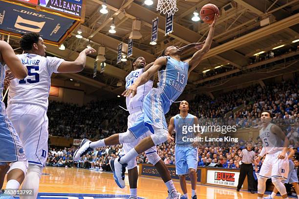 Tokoto of the North Carolina Tar Heels goes to the basket against Amile Jefferson of the Duke Blue Devils at Cameron Indoor Stadium on February 18,...