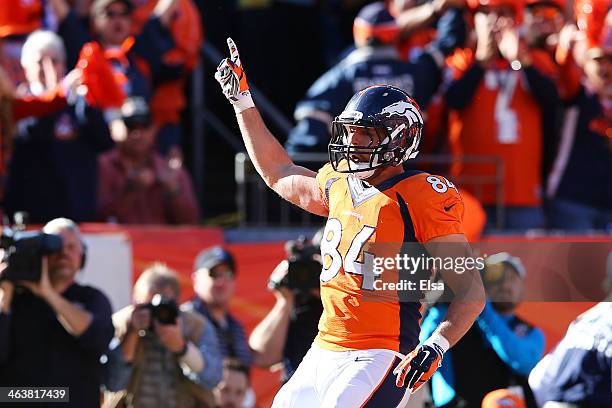 Jacob Tamme of the Denver Broncos celebrates his second quarter touchdown against the New England Patriots during the AFC Championship game at Sports...