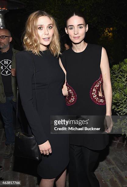 Actors Elizabeth Olsen and Rooney Mara attend VANITY FAIR and Barneys New York Dinner benefiting OXFAM, hosted by Rooney Mara at Chateau Marmont on...