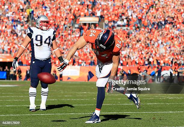 Jacob Tamme of the Denver Broncos celebrates his second quarter touchdown against the New England Patriots during the AFC Championship game at Sports...