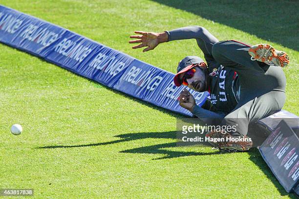 Amjad Ali of the United Arab Emirates fields the ball from the boundary during the 2015 ICC Cricket World Cup match between Zimbabwe and the United...