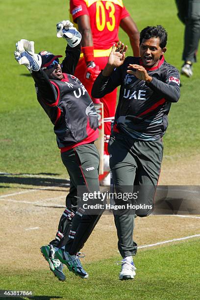 Swapnil Patil and Amjad Javed of the United Arab Emirates celebrate after taking the wicket of Hamilton Masakadza of Zimbabwe during the 2015 ICC...