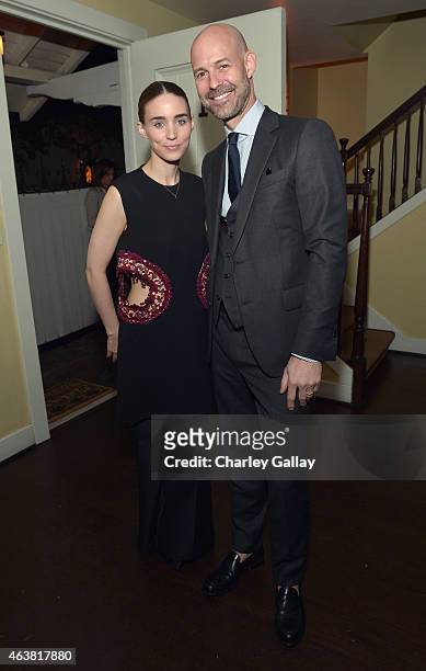 Actress Rooney Mara and publisher of Vanity Fair Chris Mitchell attend VANITY FAIR and Barneys New York Dinner benefiting OXFAM, hosted by Rooney...