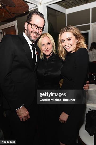 Artist Eric White and actors Patricia Arquette and Elizabeth Olsen attend VANITY FAIR and Barneys New York Dinner benefiting OXFAM, hosted by Rooney...