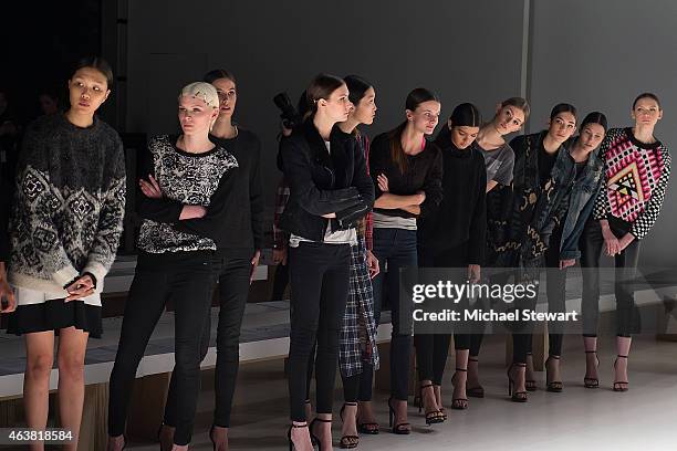 Models prepare before the Erin Fetherston show during Mercedes-Benz Fashion Week Fall 2015 at The Salon at Lincoln Center on February 18, 2015 in New...