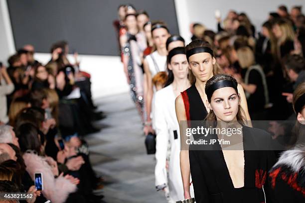 Models walk the runway at the Proenza Schouler show during Mercedes-Benz Fashion Week Fall 2015 at the Marcel Breuer Building on February 18, 2015 in...