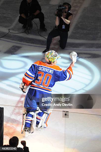 Ben Scrivens of the Edmonton Oilers salutes the crowed after being selected as the first star of the game following the game against the Boston...