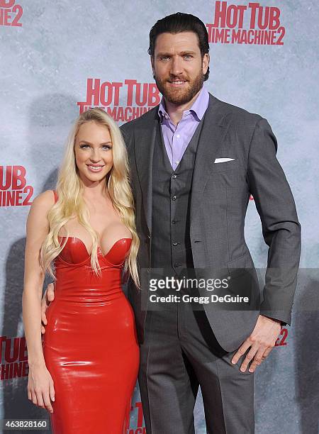 Actress Christine Bently and guest arrive at the Los Angeles premiere of "Hot Tub Time Machine 2" at Regency Village Theatre on February 18, 2015 in...