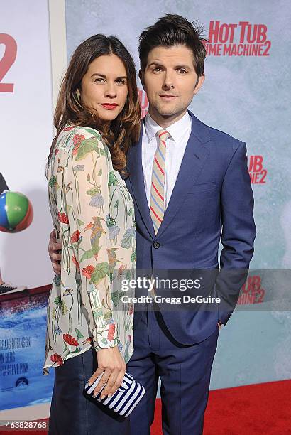 Actor Adam Scott and wife Naomi Scott arrive at the Los Angeles premiere of "Hot Tub Time Machine 2" at Regency Village Theatre on February 18, 2015...