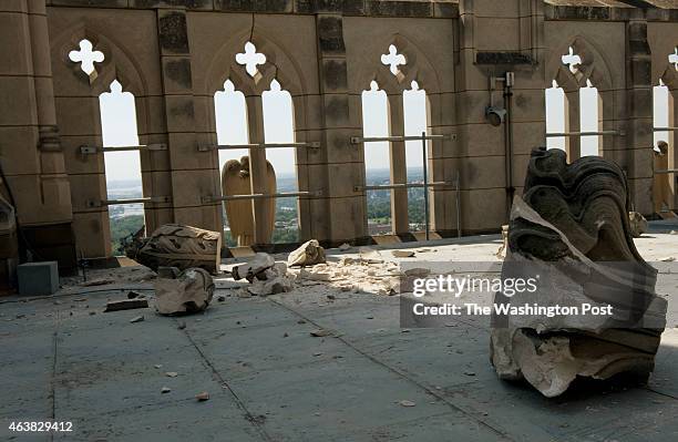 Indiana limestone is strew across the roof of the "Gloria in Excelsis" tower at The National Cathedral a day after a 5.8 magnitude earthquake rumbled...