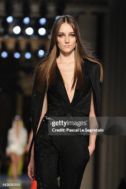 Model walks the runway during Atelier Versace show as part of Paris Fashion Week Haute-Couture Spring/Summer 2014 on January 19, 2014 in Paris,...