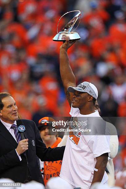Demaryius Thomas of the Denver Broncos celebrates with the Lamar Hunt Trophy after they defeated the New England Patriots 26 to 16 in the AFC...