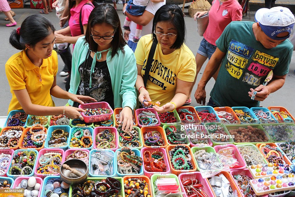 A Filipino Chinese vendors selling lucky charms in Binondo...