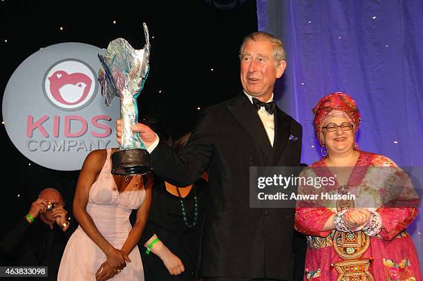 Prince Charles, Prince of Wales receives an award from founder Camila Batmanghelidjh at a Kids Company dinner on May 14, 2008 in London, England.