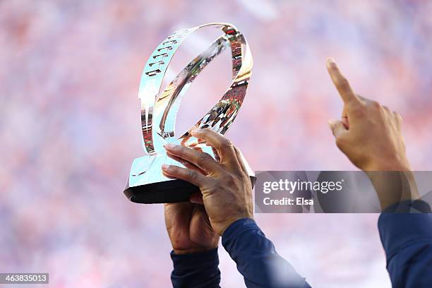 The Denver Broncos hold up the Lamar Hunt Trophy after defeating the New England Patriots 26 to 16 in the AFC Championship game at Sports Authority...