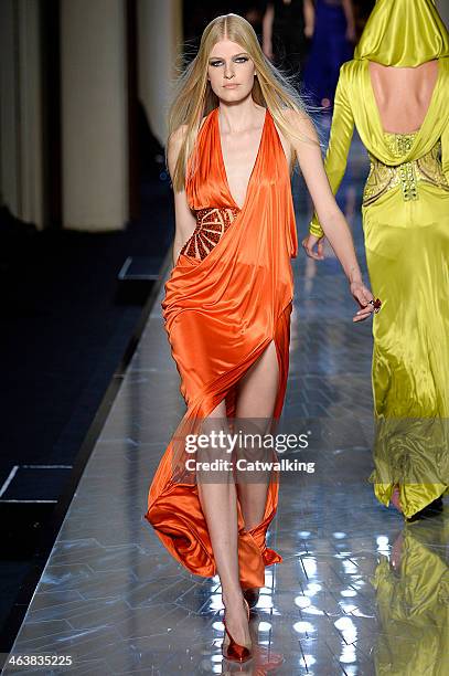Model walks the runway at the Atelier Versace Spring Summer 2014 fashion show during Paris Haute Couture Fashion Week on January 19, 2014 in Paris,...