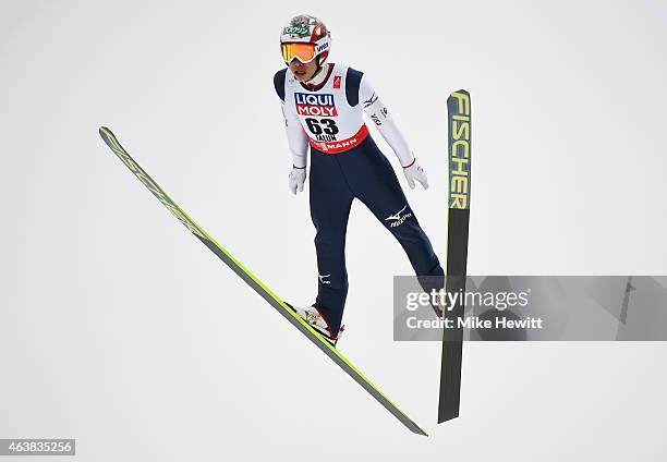 Taku Takeuchi of Japan practices during the Men's Normal Hill Ski Jumping training during the FIS Nordic World Ski Championships at the Lugnet venue...