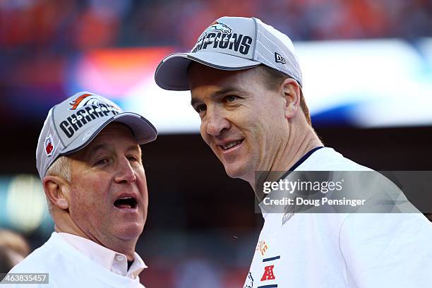 Peyton Manning and head coach John Fox of the Denver Broncos celebrate after they defeated the New England Patriots 26 to 16 in the AFC Championship...