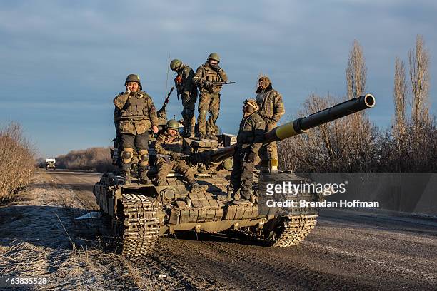 Ukrainian soldiers who left Debaltseve yesterday prepare to return to support the further withdrawal of troops on February 19, 2015 in Artemivsk,...