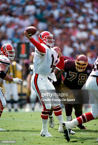 Jeff George of the Atlanta Falcons drops back to pass against the Washington Redskins during an NFL football game September 25, 1994 at RFK Stadium...