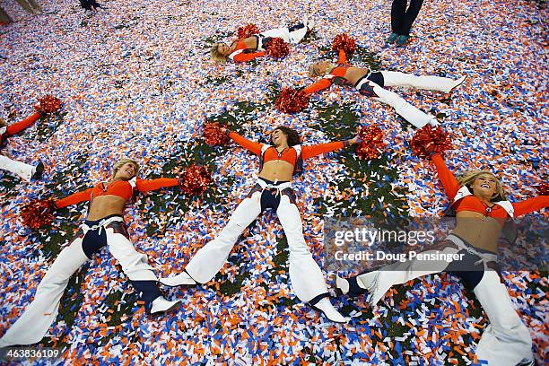 Denver Broncos cheerleaders celebrate after they defeated the New England Patriots 26 to 16 during the AFC Championship game at Sports Authority...