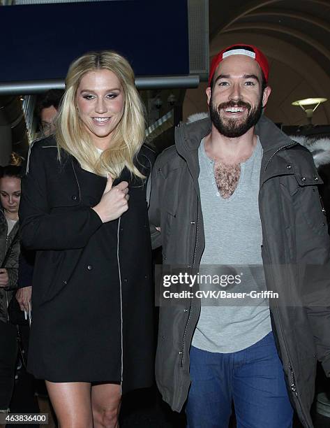 Kesha and Brad Ashenfelter seen at LAX on February 18, 2015 in Los Angeles, California.