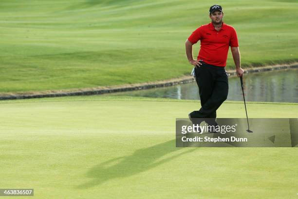 Patrick Reed assesses a putt on the 18th green during the final round of the Humana Challenge in partnership with the Clinton Foundation on the...