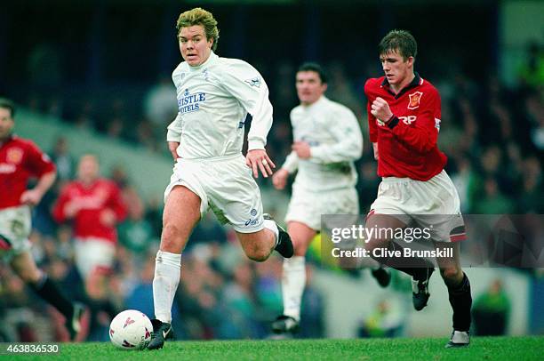 Leeds player Tomas Brolin pulls away from David Beckham during a Premier League match between Leeds United and Manchester United at Elland Road on...