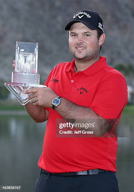 Patrick Reed poses with his trophy on the 18th green after winning the Humana Challenge in partnership with the Clinton Foundation on the Arnold...