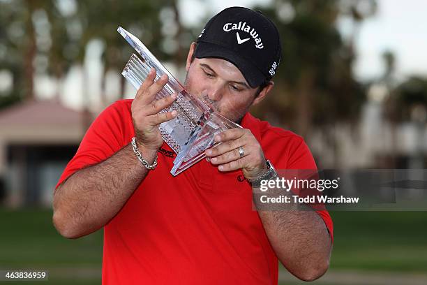 Patrick Reed kisses his trophy on the 18th green after winning the Humana Challenge in partnership with the Clinton Foundation on the Arnold Palmer...