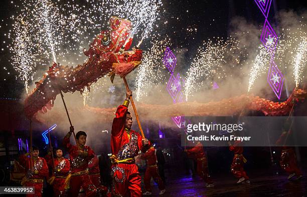 Chinese artists perform a dragon dance at a local amusement park during celebrations for the Lunar New Year February 19, 2015 in Beijing, China.The...