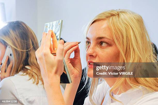 Model backstage at the Michael Kors fashion show during Mercedes-Benz Fashion Week Fall on February 18, 2015 in New York City.