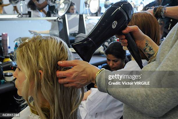 Model backstage at the Michael Kors fashion show during Mercedes-Benz Fashion Week Fall on February 18, 2015 in New York City.