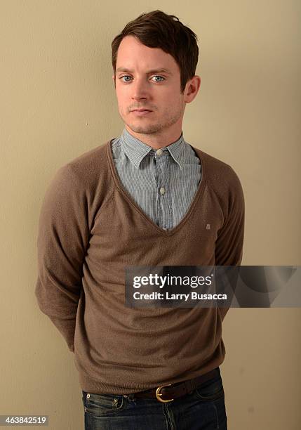 Actor Elijah Wood poses for a portrait during the 2014 Sundance Film Festival at the Getty Images Portrait Studio at the Village At The Lift...