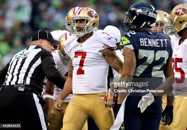 Quarterback Colin Kaepernick of the San Francisco 49ers reacts in the first half against the Seattle Seahawks during the 2014 NFC Championship at...