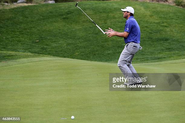 Ryan Palmer tosses his club after missing a putt on the 16th green during the final round of the Humana Challenge in partnership with the Clinton...