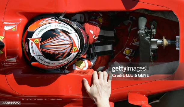Ferrari's Finnish driver Kimi Raikkonen takes part in the Formula One pre-season first test day at Catalunya's racetrack in Montmelo, near Barcelona,...