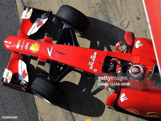 Ferrari's Finnish driver Kimi Raikkonen takes part in the Formula One pre-season first test day at Catalunya's racetrack in Montmelo, near Barcelona,...