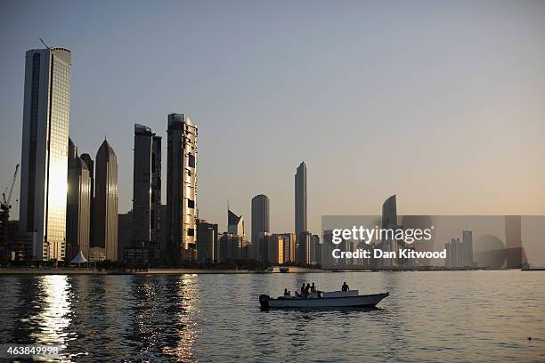 General view of the city skyline at sunset from Dhow Harbour on February 5, 2015 in Abu Dhabi, United Arab Emirates. Abu Dhabi is the capital of the...