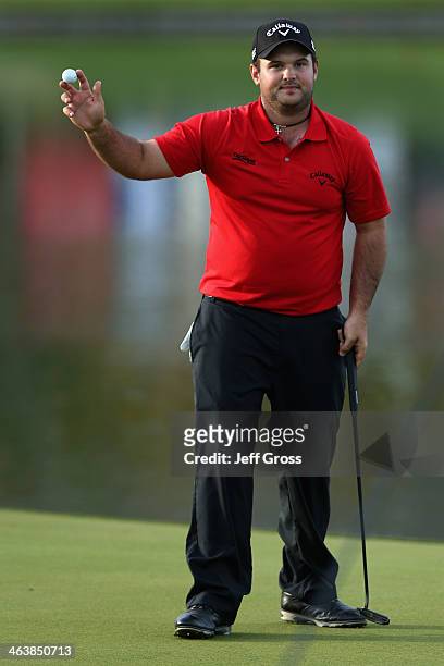 Patrick Reed acknowledges the gallery on the 18th green after winning the Humana Challenge in partnership with the Clinton Foundation on the Arnold...