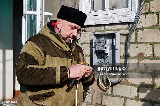 Cossack rebel restores the power inside the base as people from the ministry for civil defense and emergencies of the 'Donetsk People's Republic'...