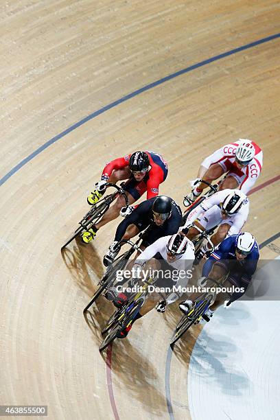 Riders including Maximilian Levy of Germany, Matthew Baranoski of USA and Edward Dawkins of New Zealand compete in the Mens Keirin first round race...