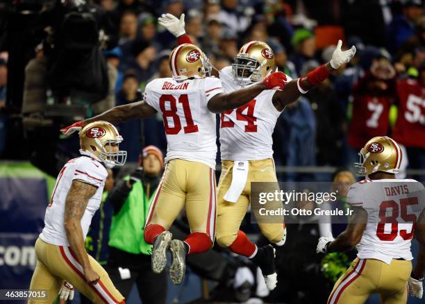 Wide receiver Anquan Boldin of the San Francisco 49ers celebrates with running back Anthony Dixon after Boldin makes a 26-yard touchdown catch...