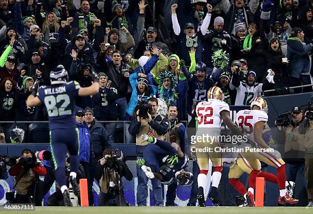 Running back Marshawn Lynch of the Seattle Seahawks dives into the end zone for a 40-yard touchdown run against the San Francisco 49ers in the third...
