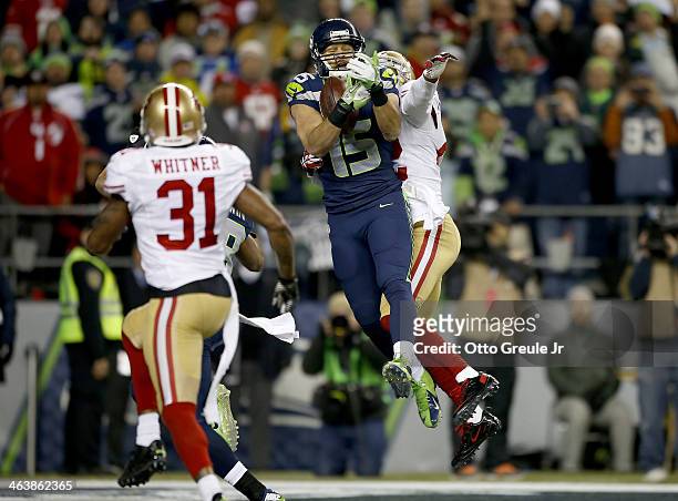 Wide receiver Jermaine Kearse of the Seattle Seahawks catches a fourth quarter touchdown against the San Francisco 49ers during the 2014 NFC...